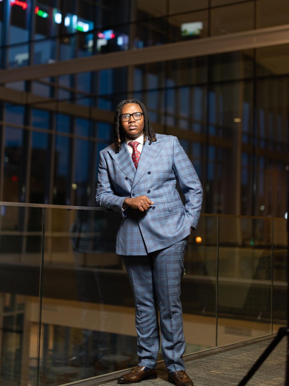 Kelvin Powe, founder of Kelvin Powe Agency, in a blue plaid double-breasted suit